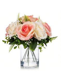 a vase filled with pink and white flowers