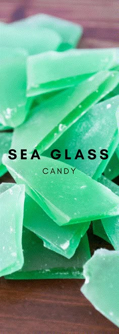 sea glass candy sitting on top of a wooden table with the words sea glass candy