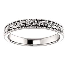 a wedding band with intricate designs on it