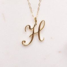 H Initial Necklace - Cursive "H" initial gold pendant - Personalized initial gold pendant for women / Gift for her / for mom / for wife / Dainty "H" initial. Perfect every day necklace. Lovely gift for your self, sister, bridesmaids, new mom. Pendant: Base metal is brass and 14K gold plated. Chain is 18 inches, 14k gold filled. Note: model shots might show a different initial, only to illustrate overall look and length of the chain. This listing is for the "H" initial. Letters Cursive, Best Selling Jewelry, Necklaces Name, Gold Initial Pendant, Yarn Necklace, Septum Nose, Pendants For Women, Tragus Conch, Gold Letter Necklace