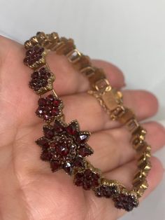 A Beautiful Antique Victorian Circa 1890s Bohemian Garnet Floral Design Bracelet with safety chain Size 7" Long x 15mm Wide at Widest Point  These true Bohemian Garnets were mined from the region that used to be known as Bohemia later to be known as Czechoslovakia  This region produced deep red garnet gemstones and a style of jewellery that became very popular in the late Victorian Era Rose cut faceting helps the gemstones sparkle in the light Presented in very good condition with secure box clasp & safety chain Antique Jewelry Victorian, Victorian Bracelet, To Be Known, Bracelets Design, Design Bracelet, Antique Wedding, Safety Chain, Jewelry Antique, Box Clasp