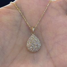 "Beautiful Pear Shape Diamond Necklace set in yellow gold. The diamonds are clear and very sparkling. Elegant and classy shape necklace. It's a nice size pendant, great to wear for any occasion. The diamond cut 14K Yellow Gold Chain has a nice sparkle to it and compliments the pendant perfectly. The chain is solid so it is strong. 18\" chain, let us know if you need a different length chain. Pendant length measures 22mm. The pear shape measures 16.2x12.5mm. Genuine Round Brilliant Cut Diamonds t Gold Pear-shaped Diamond Necklace For Formal Occasions, Gold Pear Shaped Diamond Necklace For Formal Occasions, Formal Gold Pear Shaped Diamond Necklace, Elegant Gold Diamond Necklace With Pear-shaped Pendant, Gold Pear-shaped Diamond Necklace For Anniversary, Gold Pear-shaped Diamond Necklace With Accents, Gold Pear-shaped Diamond Drop Necklace, Gold Drop Necklace With Pear-shaped Diamond, Elegant Gold Pear-shaped Diamond Necklace