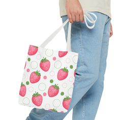 Introducing our adorably chic tote bag! Perfect for adding a pop of fruity fun to your daily style, this tote features a delightful pink strawberry design. Carry your essentials with a playful twist with our Pink Strawberry Bubbles Tote Bag. Available in 3 sizes to add both functionality and style, these tote bags come with multiple handle colors to match your designs. Made with spun polyester, these bags feature double-stitched seams, cotton webbing straps, and nonwoven laminate lining for high Strawberry Design, Bottle Garden, Pink Strawberry, 4th Of July Outfits, Bottle Shop, Blue Daisy, Red Strawberry, Coral Peach, Custom Phone Cases