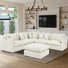 a living room with a large white sectional couch