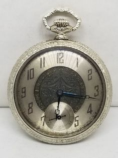 Vintage Swiss Fontain Pocket Watch, Size 36mm, 6 Jewels, Working. Not timed for accuracy. Movement with, Fontain Watch Co., Swiss, Non Magnetic, 6 Six Jewels, 2 Two Adjustments. Inside back of case with, Star Watch Case Co., Scepter, 6742202. Dial with some wear to finish. Crystal with some scratches. Case with wear to finish, some scratches and a small nick on back. We do not test items to see how long or how accurate they run. All items we sell have had a previous owner(s). None, and I'll repeat it, none of our watches online are currently serviced unless they state so in the description. To get a watch overhauled (timing etcetera) it costs 3-400+ not including shipping both ways. If an Item that is listed states, "Running", it simply means that when wound or plugged in that it is runnin Analog Pocket Watch With Round Dial For Formal Occasions, Antique Silver Watch With Round Dial, Antique Silver Watch Accessories For Anniversary, Vintage Silver Watch With Metal Dial, Antique Silver Watches With Subdials, Round Pocket Watch With Subdials For Anniversary, Silver Pocket Watch With Subdials, Collectible Silver Pocket Watch With Round Dial, Silver Collectible Pocket Watch With Round Dial