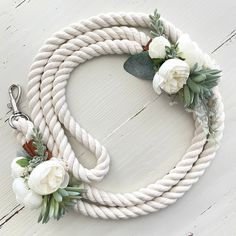 a white rope with flowers on it