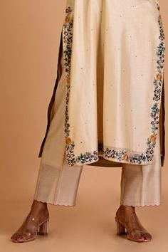 Ivory silk chanderi tunic with floral, thread and dori embroidery. Comes with pant. - Aza Fashions Spring Raw Silk Kurta With Floral Embroidery, Spring Kurta With Floral Embroidery In Raw Silk, Off White Floral Embroidered Kurta For Spring, Spring Cotton Silk Kurta With Embroidered Border, Spring Floral Embroidery Raw Silk Palazzo Set, Spring Cotton Silk Dupatta With Embroidered Border, Off White Silk Sets With Floral Embroidery, Spring Embroidered Cotton Silk Salwar Kameez, Designer Cream Kurta With Floral Embroidery