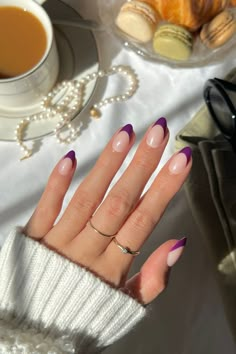 These short almond nails sport a dark purple French tip for a rich, moody vibe that’s perfect for daytime or evening glamour. 💜 concon_wi on IG wearing Plum Colored French Tips Almond Nails, Almond Tipped Nails, Simple Fall Nails Purple, Simple French Nails Color, Red And Purple Nail Ideas, Amethyst Nails Color, Dusky Purple Nails, Coffin Colored French Tip Nails, French Nails Purple Tips