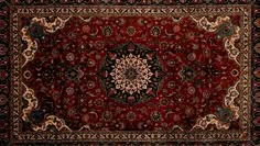 a red rug with an ornate design on it