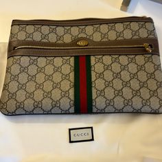 Authentic Gucci Pouch Comes With Dust Bag, Box And Ribbon. Purchased In Aspen, Co At Gucci Store. I No Longer Have Receipt. 11 X 8 Inches. One Outside Zipper , Small Marks From Pen Inside Pouch , Overall Condition Very Good. No Lowball Offers , Price Firm. Designer Crossbody Clutch With Original Box, Designer Crossbody Clutch, Designer Beige Rectangular Pouch, Designer Clutch Pouch For Shopping, Designer Shopping Clutch Pouch, Designer Pouch Clutch For Shopping, Gucci Clutch With Removable Pouch, Gucci Clutch Bag With Removable Pouch, Designer Gucci Pouch Bag