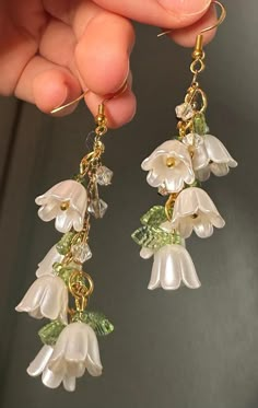 🎀Handmade earrings by Kali🎀 Stylish, Dainty, Classy, Good quality, Unique earrings, Perfect gift for her, weddings, anniversaries, and even birthdays. These alluring earrings are thoughtfully made with love, creativity, and precision. The perfect pair of classy white earrings. Inspired by the beauty of nature, flowers, leaves, and shimmering beads. ~M A T E R I A L S~ Made with care, using durable, hypoallergenic stainless steel. Earrings are nickel, tarnish and rust free. ~C A R E~ -Don't wear earrings when exercising or doing physically strenuous activities  -Don't stretch or pull earrings -Rust free, safe for water use but not recommended in order to preserve best quality  🎁Package: small, cute, jewelry earring box with bow. ~A B O U T   M E~ Hi there, my name is Kalina! I'm a Bulgar Popular Earrings 2024, Lori Aesthetic, Cottage Core Gifts, Midsummer Party, Cottage Core Jewelry, Whimsical Earrings, White Flower Earrings, Cottagecore Earrings, Gold Flower Earrings