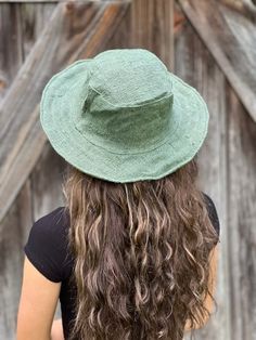 Eco-friendly Hemp Wide Brim Sun Hat – Solid Available in Natural, Black, Navy, or Olive Eco-friendly Hemp Sun Hat - Solid Our hemp sun hat is perfect for any time or anywhere..at the beach, pool, gardening, festival or just hanging around. Solid Color options: Natural, Green, Black, or Navy Hemp sun hat made from 100% hemp with a soft organic cotton lining, wire brim makes it easy to reshape. Wide brim perfect to protect your head and face from too much sun. This hat is lightweight and flexible so that can be folded for easy carrying. Easily gets back in shape 100% Hemp Adult size - available in One Size Suitable for 21 inch - 23 inch Head brim at widest point - 2 1/2 - 3 inches Crown height - 4 inches Why Hemp: Hemp fiber is lightweight and water absorbent Durable, long-lasting, and stron Casual Sun Hat For Festivals, Bohemian Sun Hat One Size Fits Most, Bohemian Lightweight Brimmed Hat, Bohemian Brimmed Lightweight Hat, Bohemian Lightweight Hat, Eco-friendly Short Brim Hat For Vacation, Adjustable Green Sun Hat With Upf 50+, Eco-friendly Woven Hats For Spring, Bohemian Lightweight Toquilla Straw Sun Hat