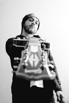 a man holding a toy car in his hands