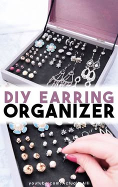 an open jewelry box filled with earrings on top of a white table next to a woman's hand and the words diy earring organizer