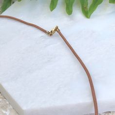 14KT yellow gold + brown tan leather cord necklace. Wear alone or add on a pendant to transform the necklace! 14k yellow gold fancy lobster clasp Cord width: 1.5mm Lengths available: 16", 18" Made in USA Leather Cord Necklace, Leather Corded Necklace, Cord Necklace, Leather Cord, Brown Gold, Tan Leather, Lobster Clasp, Made In Usa, Gold Bracelet