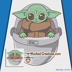 the baby yoda is sitting in an infant carrier