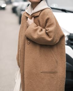 An effortlessly sophisticated everyday wool coat for fall and beyond. Designed with a roomy oversized silhouette which allows you to throw this on over any ensemble. Features minimal yet striking detailing—a unique collar lapel, dropped shoulders, single button closure and deep angled pockets.  

Color: Camel
73% Wool, 19% Polyester, 8% Alpaca; Lining: 100% Cotton Oversized Brown Wool Coat For Fall, Oversized Brown Wool Coat For Work, Oversized Brown Wool Outerwear, Oversized Brown Wool Coat, Oversized Solid Single Breasted Wool Coat, Oversized Solid Single-breasted Wool Coat, Brown Wool Outerwear For Everyday, Brown Long Coat Outerwear For Everyday, Brown Long Coat For Everyday Wear