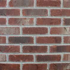 a red brick wall that is very close up