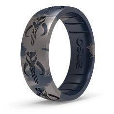 a black and gray ring with an image of scorpions on the inside of it