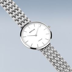 Ladies Titanium  New In: Our new ladies' watches from the Titanium Collection are truly eye-catching. Available in silver, gold and a bicolor look, they are the perfect choice for fashion-conscious women looking for an elegant and robust watch.  The watches are made of high-quality titanium. This material is extremely strong, ultra-light and hypoallergenic. The titanium bracelets fit smoothly and give the watch an elegant and delicate look. The high wearing comfort makes them perfect for daily u Silver Stainless Steel Business Watches, Silver Stainless Steel Watch For Business, Silver Minimalist Metal Watch, Silver Minimalist Metal Watches, Modern Silver Watches With Stainless Steel Clasp, Classic Metal Watches With Subdials, Classic Metal Watch For Formal Occasions, Classic Silver Metal Jewelry And Watches, Elegant White Metal Watch