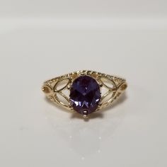 "Thanks for shopping our vintage estate store. We tend to sell well below wholesale and truly hope you enjoy all of our items. Many of the items are one of a kind, so please enjoy scrolling through the pictures and hopefully something will catch your eye. Spots are from reflections or camera. Estate 10k yellow gold created 1.5ct alexandrite cocktail filigree ring. The color of the gem is blue, purple to green with some pink, depending on light. No scratches on the gem. Stunning. Vintage setting, Victorian Sapphire Ring In 14k Gold Oval, Victorian Oval Sapphire Ring In 14k Gold, Antique Oval 14k Gold Topaz Ring, Antique 14k Gold Oval Topaz Ring, Antique Oval Topaz Ring In 14k Gold, Oval Heirloom Birthstone Promise Ring, Heirloom Oval Birthstone Promise Ring, Vintage Oval Sapphire Birthstone Ring, Vintage Oval Sapphire Ring As Birthstone