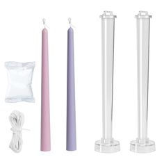 three candles, one pink and one purple are next to each other