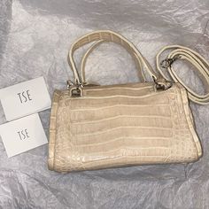 Offering A Nwots Nancy Gonzalez For Tse Cream Crocodile Mini (Nano) Speedy Three Way Bag With Silver Hardware & Detachable Shoulder Strap Handle Bag. Crossbody Bag. Shoulder Bag. *This Bag Is Clean! Never Been Used! Clean Purple Suede Interior With One Zippered Pocket/One Open Pocket & On Other Side There Are Three Open Pockets (One Larger & Two Which Hold A Lipstick Or Writing Utensils) Four Feet On Bottom Of Bag Dimensions; 8”W X 5.5”H X 4”W Two Handle Drop 3.5” Detachable Strap Drop 18” (Not Nano Speedy, Nancy Gonzalez, Writing Utensils, Purple Suede, Handle Bag, Bag Shoulder, Silver Hardware, Limited Time, Crossbody Bag