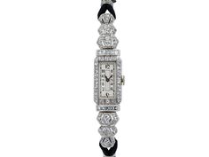 The elongated white dial with Arabic numerals, within a round diamond border, between two rows of square cut diamonds, extending to the bracelet with openwork diamond finishing with a corded strap. Movement signed AR, case with French metal marks and numbered 26823. Jewellery Marketing, Art Deco Diamond, Square Cut, Diamond Watch, White Dial, Round Diamond, Round Diamonds, Diamond Cuts, Platinum