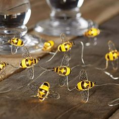 Decorate your home or any event that you may have with this Mainstays 18 LED Bumble Bee Wire String Lights. The unique design will surely delight everyone around. It is perfect for weddings, or floral arrangements. This light set is equipped with Battery Operated Automatic Timer, so that you can set it up to light and it can turn on again at the same time the next day. The string lights has 6Ft lighted length and 7Ft total length. The lead cable from the battery box to the first LED is 12 inches Bumblebee Birthday Party Decorations, Bee Themed Baby Shower Table Decor, Honey Bee Table Decor, Bumble Bee Christmas Tree, Bug Themed Wedding, Beeday Party Decor, What Will It Bee Gender Reveal Ideas, Honey Bee Birthday Party Decorations, Bumble Bee Nursery Ideas