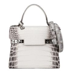 Mightychic offers a Limited Edition Delvaux Tempete PM bag featured in Blanc Casse Himalayan Crocodile. Exquisite and sought after, the Himalaya Crocodile Tempete is a one of one created, making this a collectors treasure. Inspired by a sailboat's trapeze, the Delvaux Tempete was designed in the 1960s for the Yachting Collection. Two metal studs on each side of the front has a unique clasp that can be left open or closed. Each way gives a different flair and feel to the bag. The front flap has a Delvaux Bag, Dream Bags, Limited Edition Bag, One Of One, Bag Collection, Hermes Handbags, Jewelry Inspo, Himalayan, Fashion Handbags