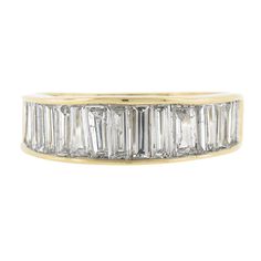 --Stone(s):-- (18) Natural Genuine Diamonds - Straight Baguette Cut - Channel Set - G/H Color - VS1-SI2 Clarity - 2.0-2.50ctw (approx.) Total Carat Weight: 2.0-2.50 (approx.) Material: Solid 18k Yellow Gold Weight: 4.10 Grams Ring Size: 7.0 (Fitted on a finger. We can custom size this ring.) Ring Width: 6.3mm (0.25") (top of the ring - north to south) - 3.5mm (bottom of the shank) Ring Height: 4.2mm rise off the finger Condition: Excellent condition! Stock Number: Mk-41015535-24020308-PAR-EY Diamond Band Ring, Baguette Cut Diamond, Diamond Rings Bands, Channel Set, Baguette Cut, Diamond Band, Ring Ring, Diamond Bands, G H