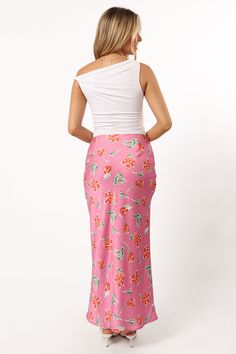 DETAILS   This midi length skirt is the perfect addition to your wardrobe. The slip style with invisible side zip ensures a comfortable fit, while the floral print detail gives it an extra touch of fun.    slip style skirt    midi length   invisible side zip  floral print design  soft satin feel   lined     material - 100% polyester     SIZING     model is 5' 5" and wears a Size XS    model stats: bust - 31.5", waist - 25.5", hips - 37"         GARMENT CARE    cold hand wash separately Floral Print Rayon Midi Skirt, Fitted Floral Print Asymmetrical Skirt, Rayon Skirt For Brunch, Fitted Asymmetrical Floral Print Skirt, Fitted Asymmetrical Skirt With Floral Print, Relaxed Pencil Skirt With Side Slits For Spring, Floral Print Midi Maxi Skirt For Brunch, Fitted Floral Print Maxi Skirt For Brunch, Spring Floral Print Midi Pencil Skirt