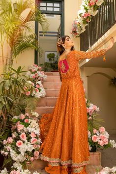 Royal Front Open Pishwas Lehenga Pakistani Bridal Dress in alluring orange shade comes in premium fabric. Hand-crafted embellishments of kora dabka and shimmering ornaments make this stunning Pishwas Dress your foremost priority for the most important day of your life. Pishwas: Pakistani Bridal Pishwas in premium silk net is an epitome of tradition and elegance. Traditional designs and golden details make this beautiful Pishwas Frock a charismatic masterpiece. Crystals, sequins, gota, and tilla Orange Georgette Choli For Reception, Orange Semi-stitched Salwar Kameez For Wedding, Semi-stitched Orange Salwar Kameez For Wedding, Semi-stitched Orange Lehenga With Mirror Work, Orange Raw Silk Sharara With Pallu, Festive Peach Lehenga With Dabka Work, Peach Anarkali Lehenga With Dabka Work, Orange Raw Silk Sharara For Diwali, Semi-stitched Orange Choli With Mirror Work