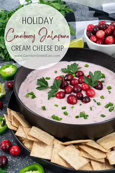 holiday cranberry jalapeno cream cheese dip in a bowl with crackers