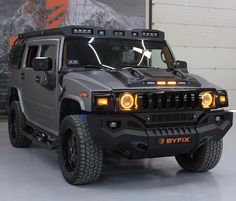 a hummer truck is shown with its lights on