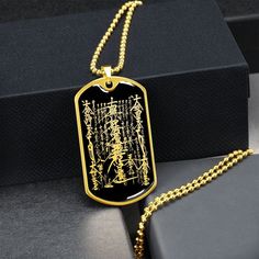 "This Nam Myoho Renge Kyo Necklace Is the Perfect Gift Whether for Yourself or a Loved One.  Explore all our Inspirational jewelry here: https://www.etsy.com/in-en/shop/SymbolicPresent?ref=seller-platform-mcnav§ion_id=31033166 ➜ Our jewelry is made of high-quality surgical steel with a shatterproof liquid glass coating and an 18k gold finish option. ➜ Engrave onto the back of the Nam Myoho Renge Kyo pendant your loved one's name, your wedding date, an anniversary, or anything else you want to re Black Rectangular Spiritual Jewelry, Bohemian Engraved Jewelry For Good Luck, Black Pendant Jewelry For Blessing, Gold Etched Rectangular Pendant Jewelry, Gold Rectangular Pendant With Etched Details, Spiritual Engraved Dog Tag Jewelry, Symbolic Engraved Dog Tag Jewelry, Spiritual Rectangular Jewelry For Good Luck, Rectangular Spiritual Jewelry For Good Luck