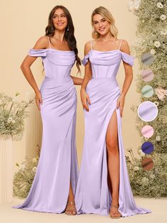 two women in purple dresses standing next to each other with their hands on their hips