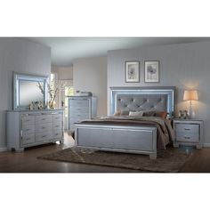 a bedroom scene with focus on the bed and dresser