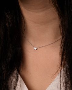 Add a sparkle of shine to your everyday look. This diamond bezel pendant set in your choice of 14k white or yellow gold is adjustable from 14 to 16 inches, enclosed by a lobster clasp. Its dainty style makes it perfect for everyday wear. Carat | 0.20 ctw (+/- .01cts)Clarity | VSColor | DEFCut | Emerald Note: In-stock products ship same-day or next-day depending on the time of your order. For made-to-order items please allow up to 1-3 weeks to ship your newest piece of fine jewelry. Minimalist Diamond White Necklace With Bezel Setting, Silver Dainty Jewelry With Single Cut Diamonds, Modern Solitaire Necklace With Single Cut Diamonds For Gifts, Dainty White Gold Jewelry With Bezel Setting, Minimalist Cubic Zirconia Necklace With Bezel Setting, Minimalist Silver Jewelry With Single Cut Diamonds, Minimalist Bezel-set Diamond Necklace For Anniversary, Minimalist White Gold Solitaire Necklace With Bezel Setting, White Gold Solitaire Necklace With Square Pendant As Gift