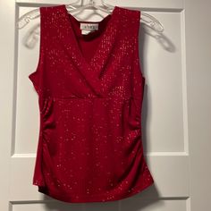 Sleeveless Red Tank Top With Sparkle Accents. Never Worn Sleeveless Summer Holiday Tops, Sleeveless Tops For Summer Holiday, Red Sleeveless Tank Top For Night Out, Elegant Red Tank Top For Night Out, Elegant Red V-neck Tank Top, Fitted Sleeveless Top For Holiday, Red Sleeveless Blouse For Party, Red Sleeveless Holiday Tops, Sleeveless Tops For Spring Holiday