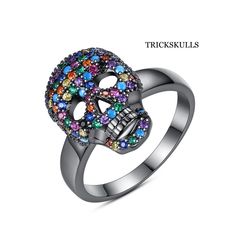 Color Iced Stainless Cubic Zirconia Glam Gothic Punk Skull Ring Sizes 7 8 & 9 New & Sealed! This Is The One Of The Coolest Modern Skull Rings We Sell. The Colors On This This Ring And It’s Minimalist Design Make It Versatile For Wearing Or Gifting On Any Occasion. It Spans Styles From Biker Punk To Glam Gothic To Elegantly Sublime. See Our Other Listings For The Dark Silver Anodized Colorful Cz Version Of This Ring And Matching Necklaces. Ships Free, New And Sealed In A Black Velvet Jewelry Pouc Punk Black Ring For Halloween, Black Punk Rings For Halloween, Punk Black Rings For Halloween, Punk Style Black Skull Ring Gift, Edgy Black Skull Ring For Halloween, Black Skull Rings In Punk Style, Black Skull Rings Punk Style, Adjustable Black Punk Skull Ring, Edgy Black Metal Skull Ring