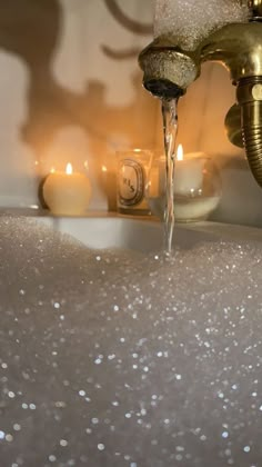 a faucet running water from it's spout in a bathroom sink