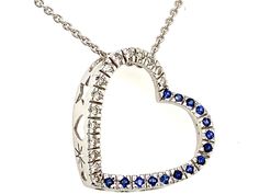 PRODUCT DESCRIPTION: 14k White Gold Heart Outline Charm Pendant Necklace With Diamonds & Blue Sapphire Gem Stones / Half Sapphire Half Diamond Heart Pendant - Solid 14k White Gold - Natural Diamonds / Total Weight: .15 Carats - High Quality Diamonds: (F-G Color / VS Clarity) - Genuine Blue Sapphires: .25 Carats - Pendant Dimensions: (23mm Height) x (23mm Width) - Chain Details: Solid 14k Gold Cable Chain With Lobster Lock (Approx 1mm Chain Width)  ------------------------------------------------ Anniversary Sapphire Heart Pendant Necklace, Fine Jewelry Sapphire Heart Pendant, Sapphire Heart Pendant Necklace With Gemstone, Blue Heart-cut Necklaces With Heart Charm, White Diamond-cut Heart Pendant Necklace, Sapphire Gem, Necklace With Diamonds, Heart Outline, 18k Gold Chain