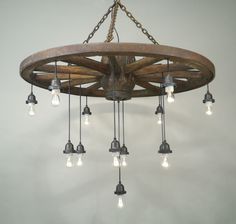 a wooden chandelier with many lights hanging from it