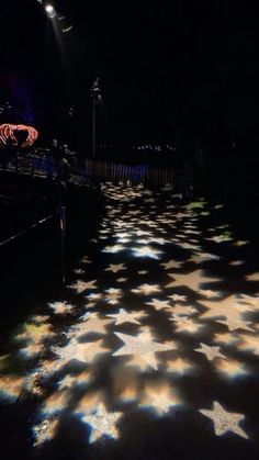 the floor is covered with stars and lights