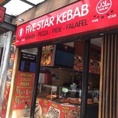 a restaurant called five star kebab with pizzas in the front and outside