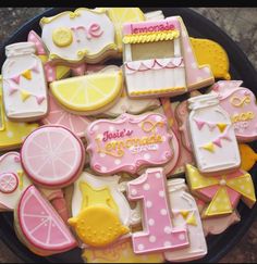 decorated cookies in the shape of baby's first birthday