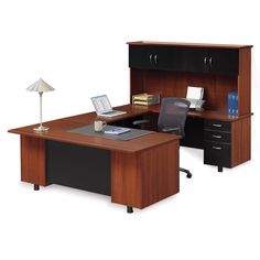 an office desk with two cabinets and a lamp