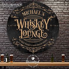 a sign that says michael's whiskey lounge on the side of a brick wall