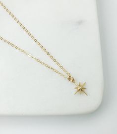 dainty gold necklace, gift for women, star necklace, Celestial jewelry, Dainty jewelry, Gold necklace, simple necklace, starburst necklace Gold North star necklace. The perfect everyday piece. Layer it or wear it solo. MADE TO LAST: * Gold filled cable Chain with gold filled spring ring clasp closure. *Matte Gold plated star charm approx 10mm x 10mm *Chose your perfect length SHIPPING: Free domestic shipping on all orders PACKAGING All pieces come beautifully packaged, perfect for gift giving. F Everyday Celestial Star Necklace, Minimalist Star Charm Necklace As Gift, 14k Gold Star Necklace As Gift, 14k Gold Star Necklace For Gift, 14k Gold Star Necklace Perfect For Gifts, Minimalist Star Charm Necklace For Gift, Minimalist Gold Necklace With Star Of David, Gold Minimalist Star Of David Charm Necklace, Gold Star Necklace Perfect As A Gift